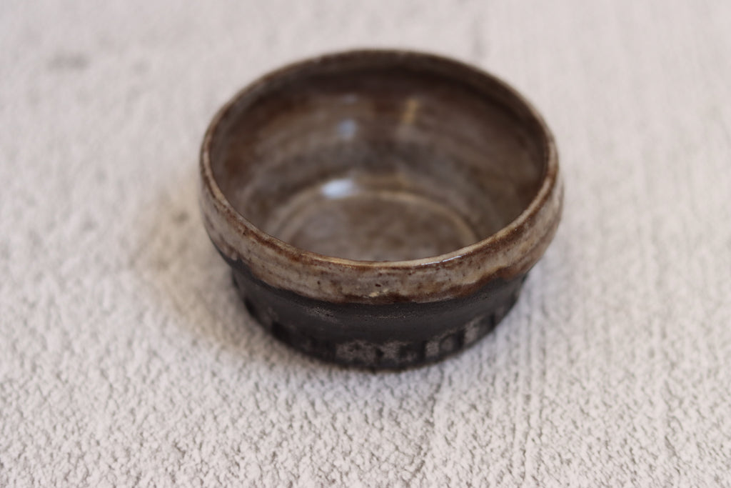 132. Black clay dip bowl
