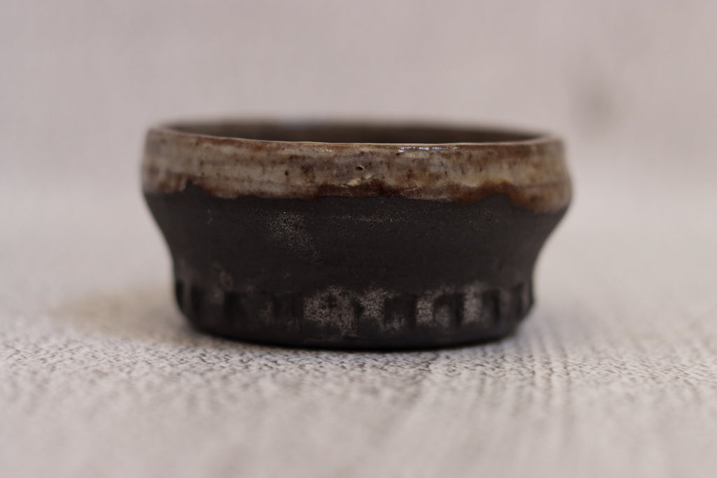 132. Black clay dip bowl