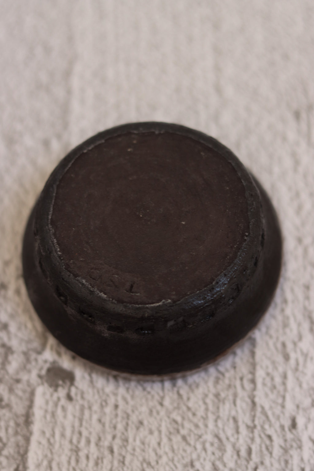 132. Black clay dip bowl