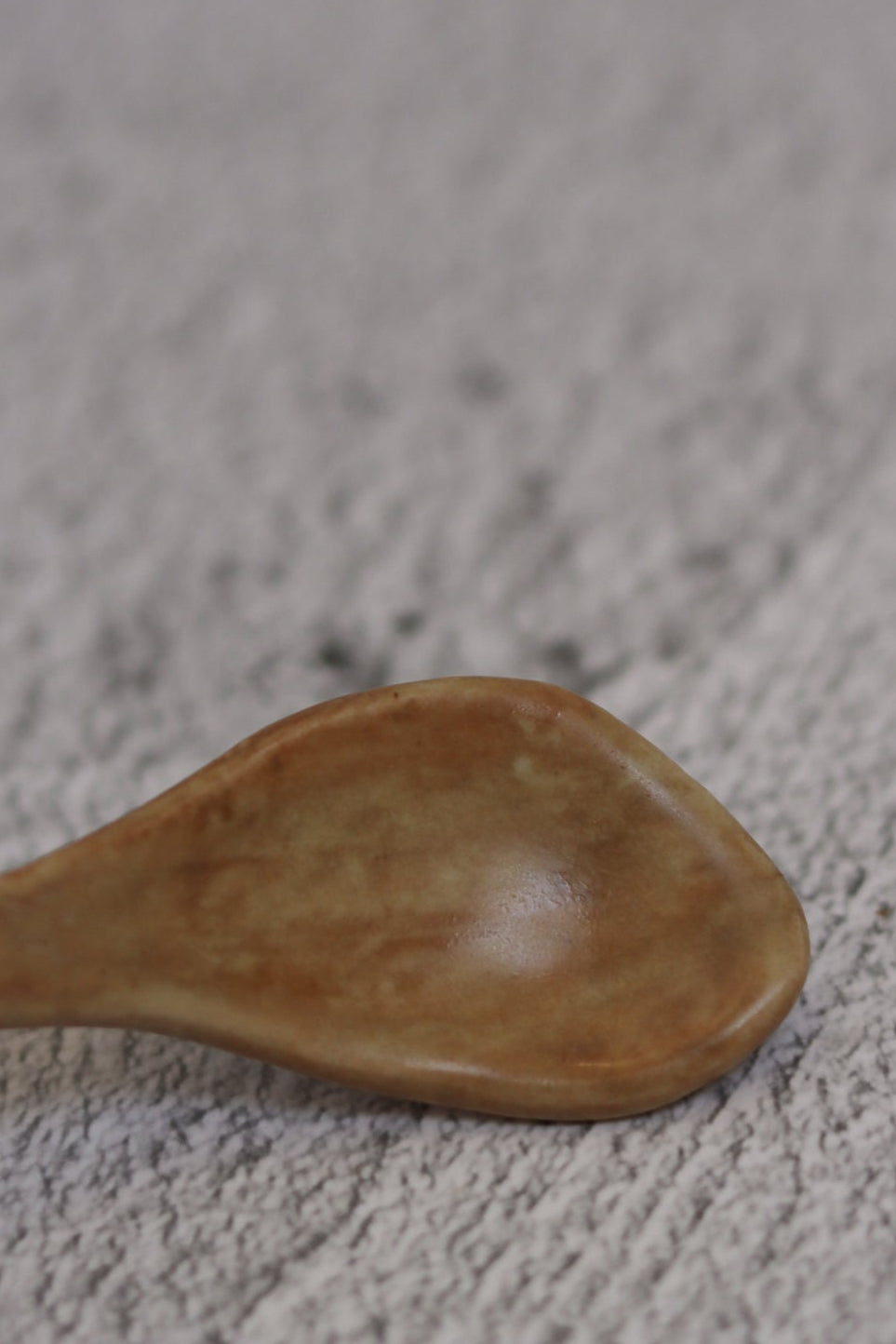 122. Offset Spoon Tan